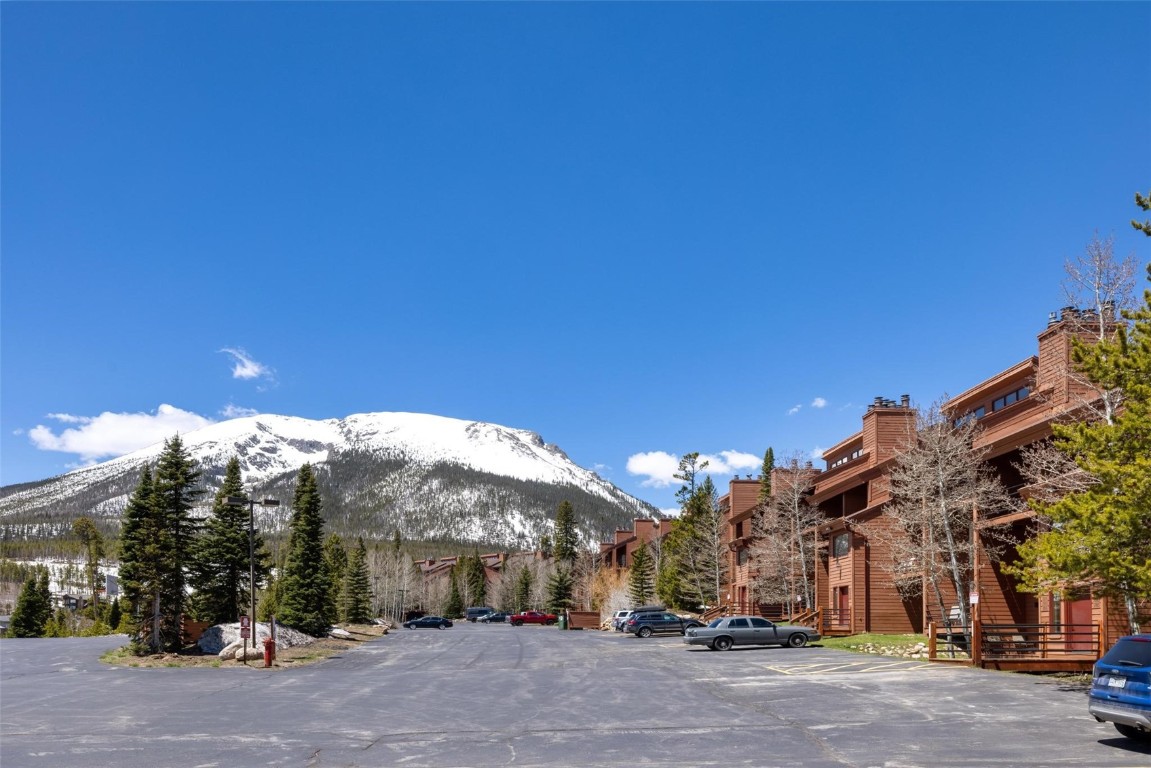 a view of a street with a building in the background