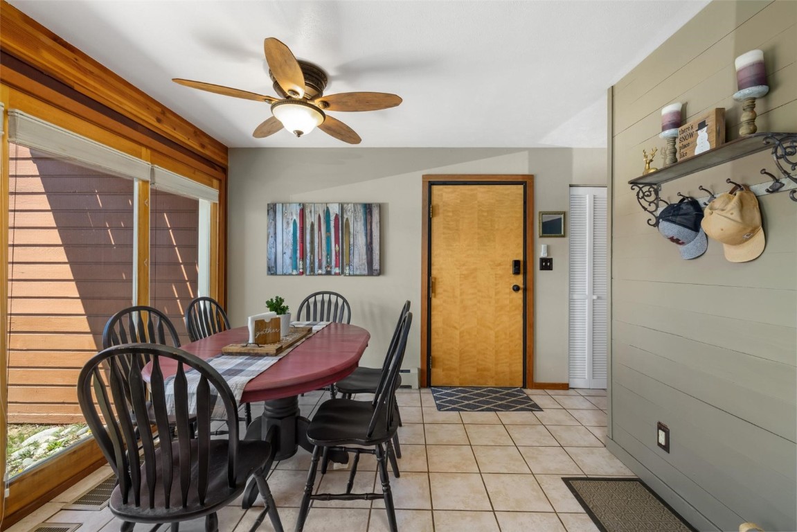 91200 Ryan Gulch Road, Unit 91204 Wildernest, CO 80498 - Photo 16 of 21 a view of a dining room with furniture and a chandelier fan
