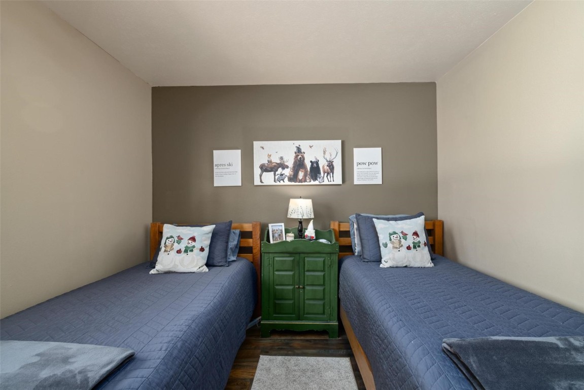 91200 Ryan Gulch Road, Unit 91204 Wildernest, CO 80498 - Photo 19 of 21 a bedroom with furniture and a window