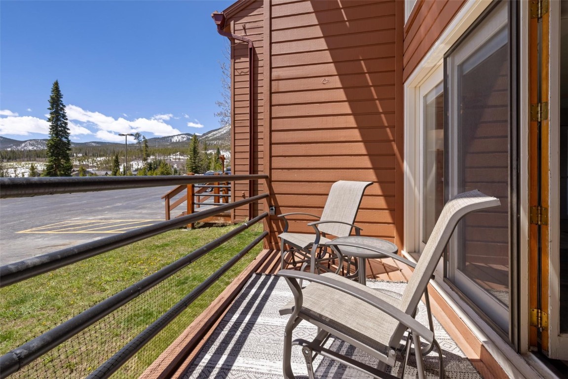 91200 Ryan Gulch Road, Unit 91204 Wildernest, CO 80498 - Photo 21 of 21 a view of a balcony with two chairs and a table