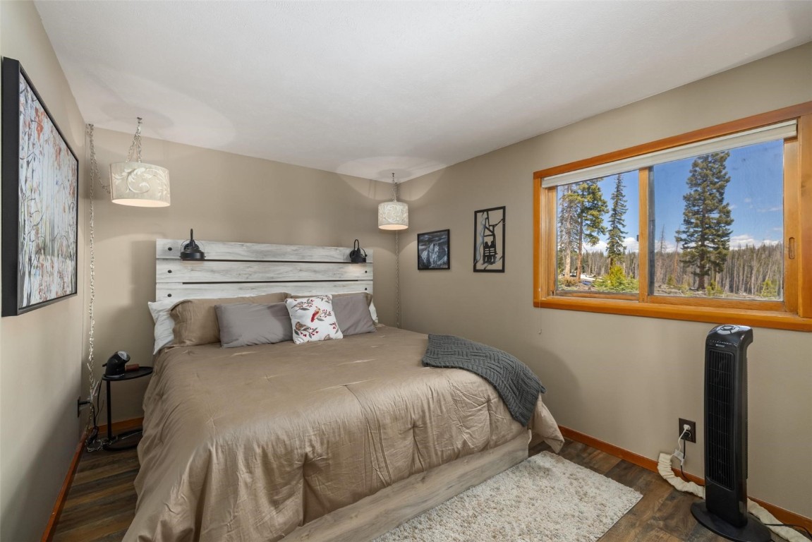 91200 Ryan Gulch Road, Unit 91204 Wildernest, CO 80498 - Photo 5 of 21 a bedroom with a large bed and a window