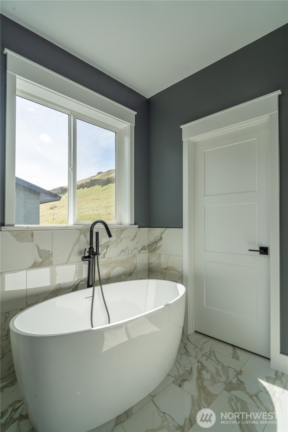 201 Bridgeview Drive Vantage, WA 98950 - Photo 15 of 40 a white bath tub sitting in a bathroom