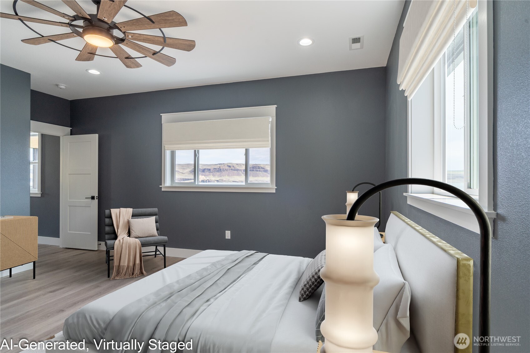 201 Bridgeview Drive Vantage, WA 98950 - Photo 24 of 40 a bedroom with a bed and a chandelier