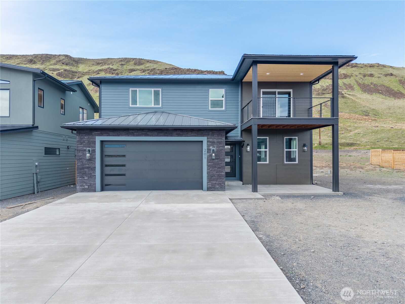 201 Bridgeview Drive Vantage, WA 98950 - Photo 40 of 40 a front view of a house with a yard and garage