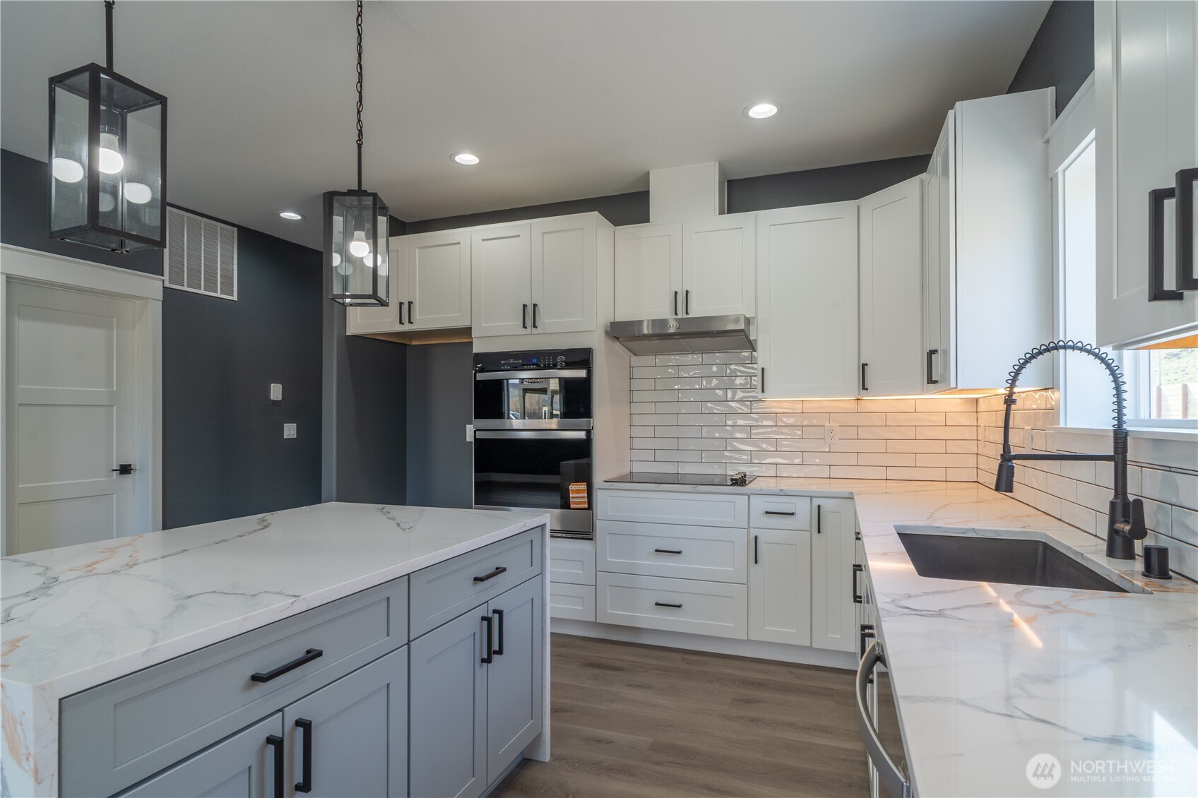 201 Bridgeview Drive Vantage, WA 98950 - Photo 7 of 40 a kitchen with stainless steel appliances kitchen island granite countertop a refrigerator and a sink