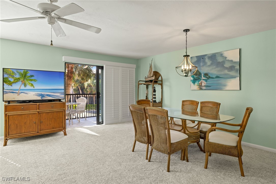 5117 Sea Bell Road, Unit C207 Sanibel, FL 33957 - Photo 11 of 43 a dining room with furniture and window