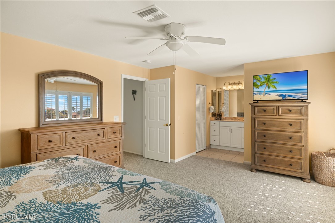 5117 Sea Bell Road, Unit C207 Sanibel, FL 33957 - Photo 18 of 43 a bedroom with a bed and a dresser