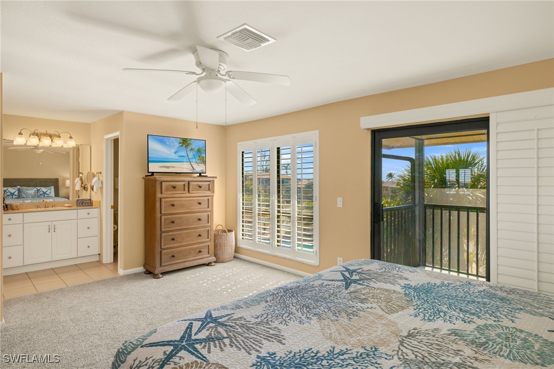 5117 Sea Bell Road, Unit C207 Sanibel, FL 33957 - Photo 19 of 43 a view of a bedroom with furniture and windows