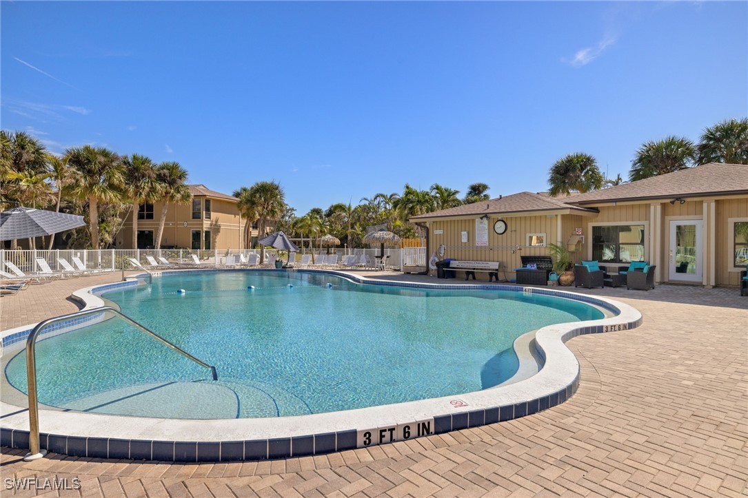 5117 Sea Bell Road, Unit C207 Sanibel, FL 33957 - Photo 27 of 43 a view of a swimming pool with outdoor seating