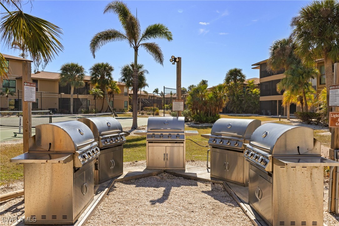 5117 Sea Bell Road, Unit C207 Sanibel, FL 33957 - Photo 28 of 43 a view of a backyard with swimming pool and furniture