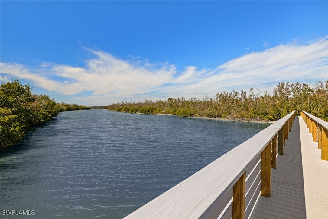 5117 Sea Bell Road, Unit C207 Sanibel, FL 33957 - Photo 34 of 43 a view of a lake with a terrace
