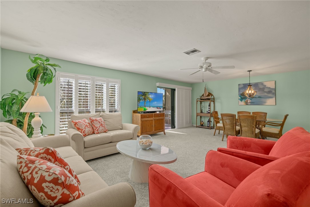 5117 Sea Bell Road, Unit C207 Sanibel, FL 33957 - Photo 8 of 43 a living room with furniture and a window