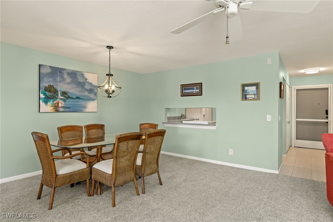 5117 Sea Bell Road, Unit C207 Sanibel, FL 33957 - Photo 10 of 43 a view of a dining room with furniture