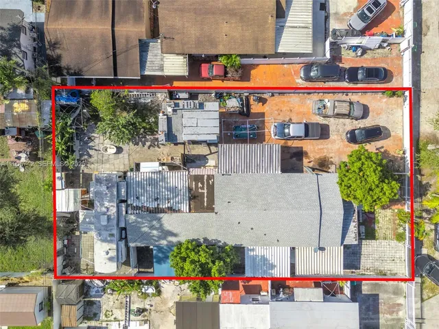 an aerial view of residential building with parking space