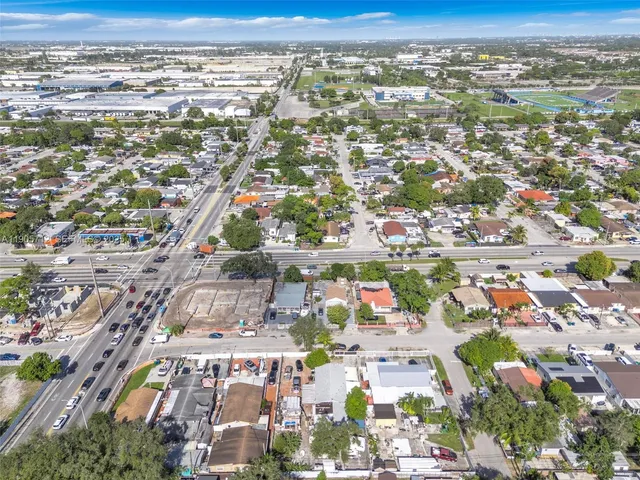 an aerial view of residential building and parking space