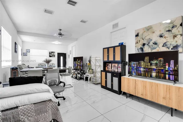 a living room with furniture and window