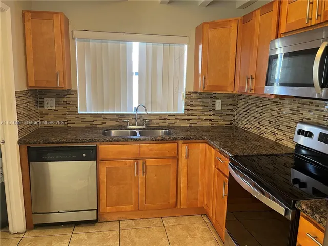 a bathroom with a shower and a sink