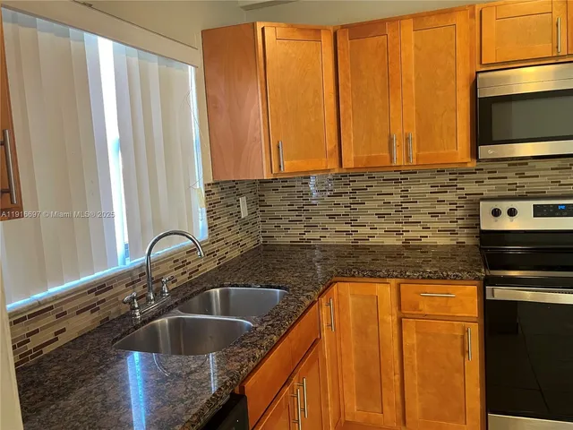 a view of a kitchen with a window