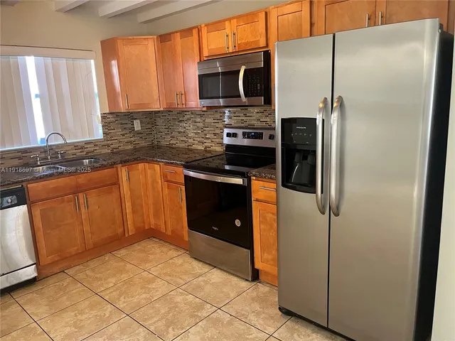 an empty room with a empty space and windows