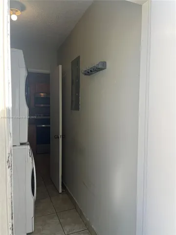 a bathroom with a sink a toilet a mirror and shower