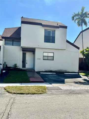 a kitchen with stainless steel appliances granite countertop a refrigerator and a stove