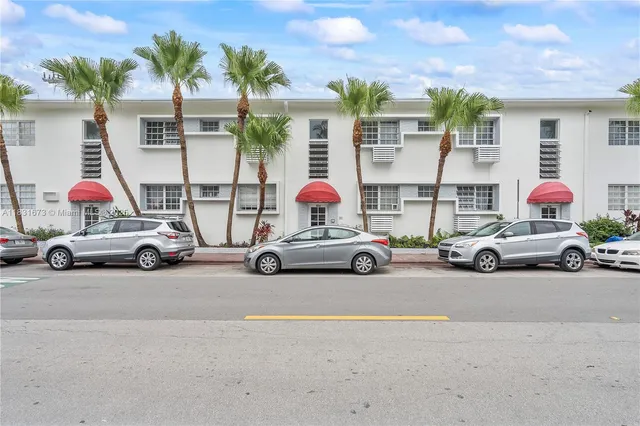 a view of a cars parked in front of a house