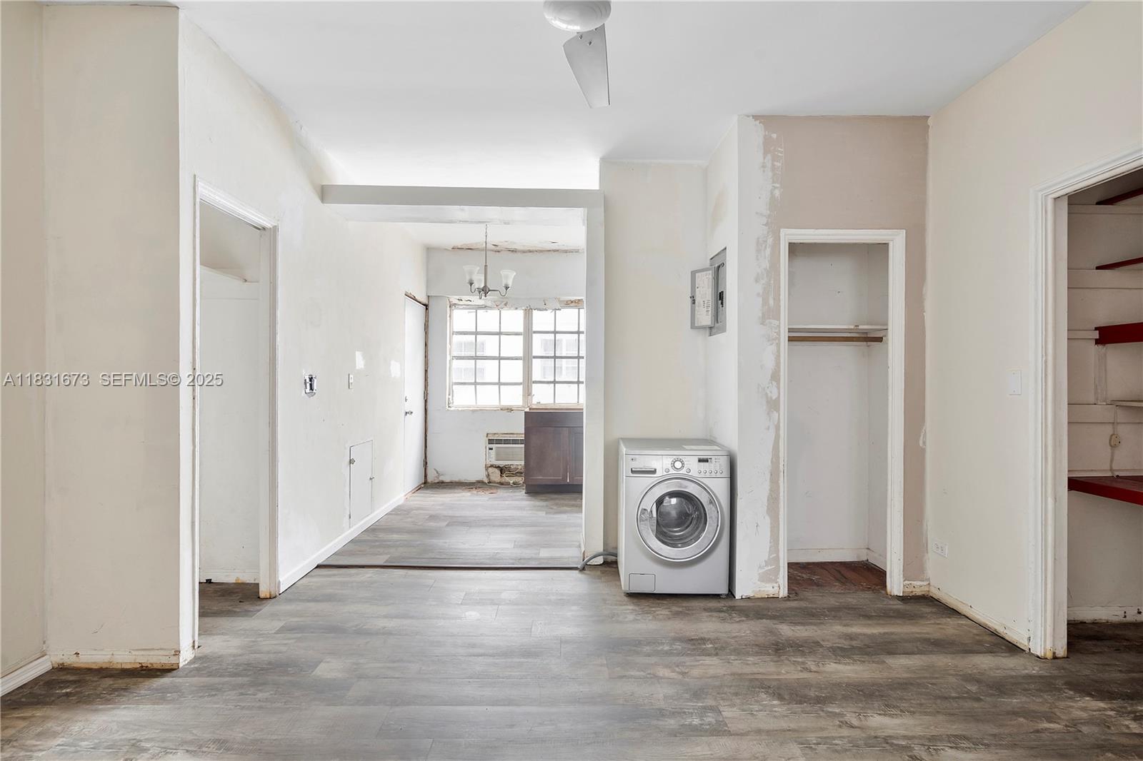 836 10th Street, Unit 6 Miami Beach, FL 33139 - Photo 7 of 12 a view of a livingroom with washer and dryer
