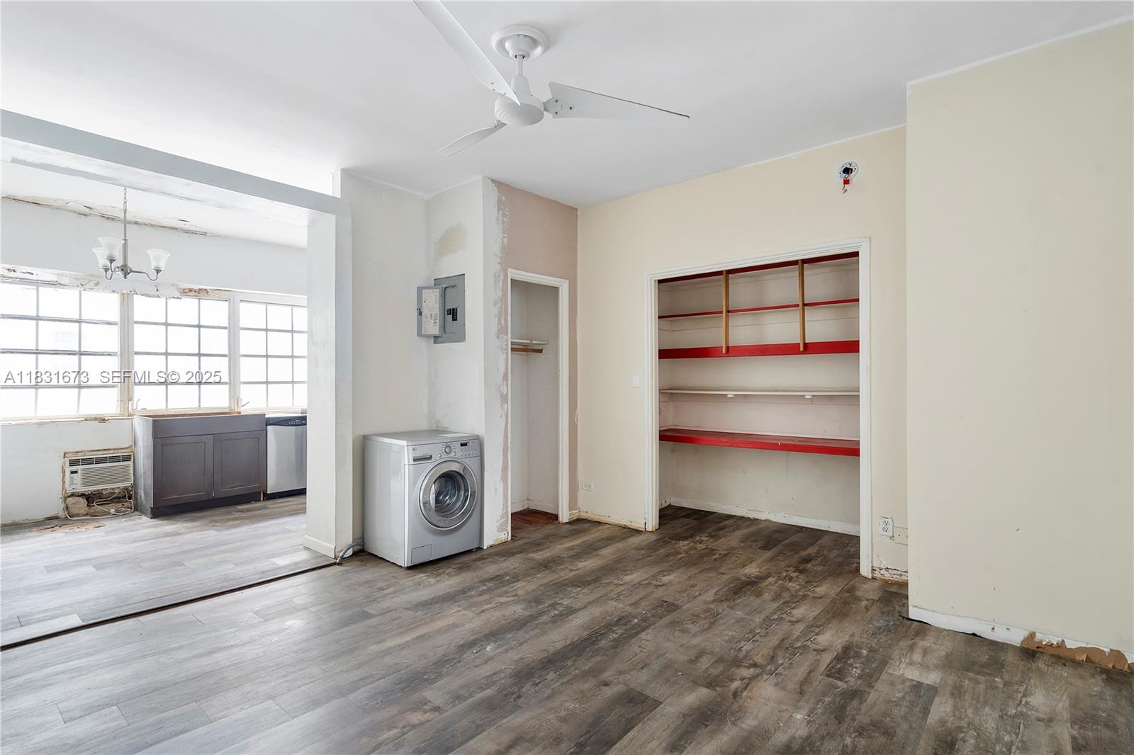 836 10th Street, Unit 6 Miami Beach, FL 33139 - Photo 8 of 12 a view of a livingroom with a furniture wooden floor and window
