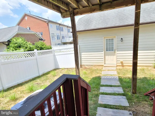 a view of a two chairs and table in the balcony