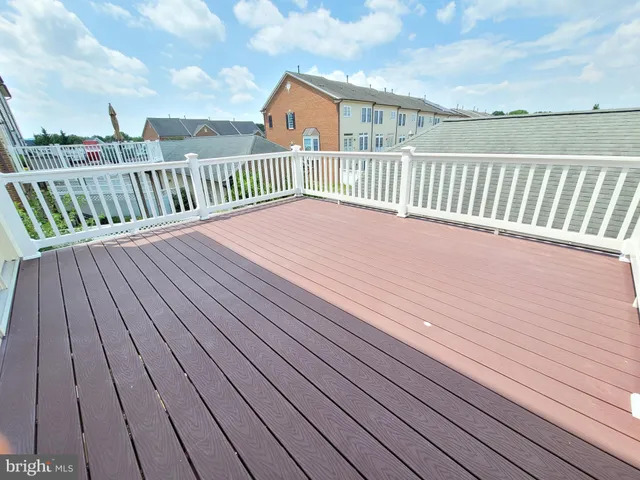 a balcony with wooden floor