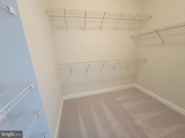 a view of a room with racks on the wall