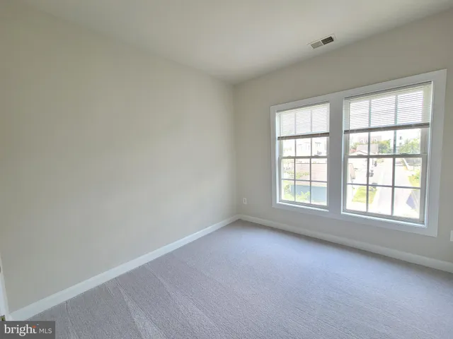 a view of hallway with windows
