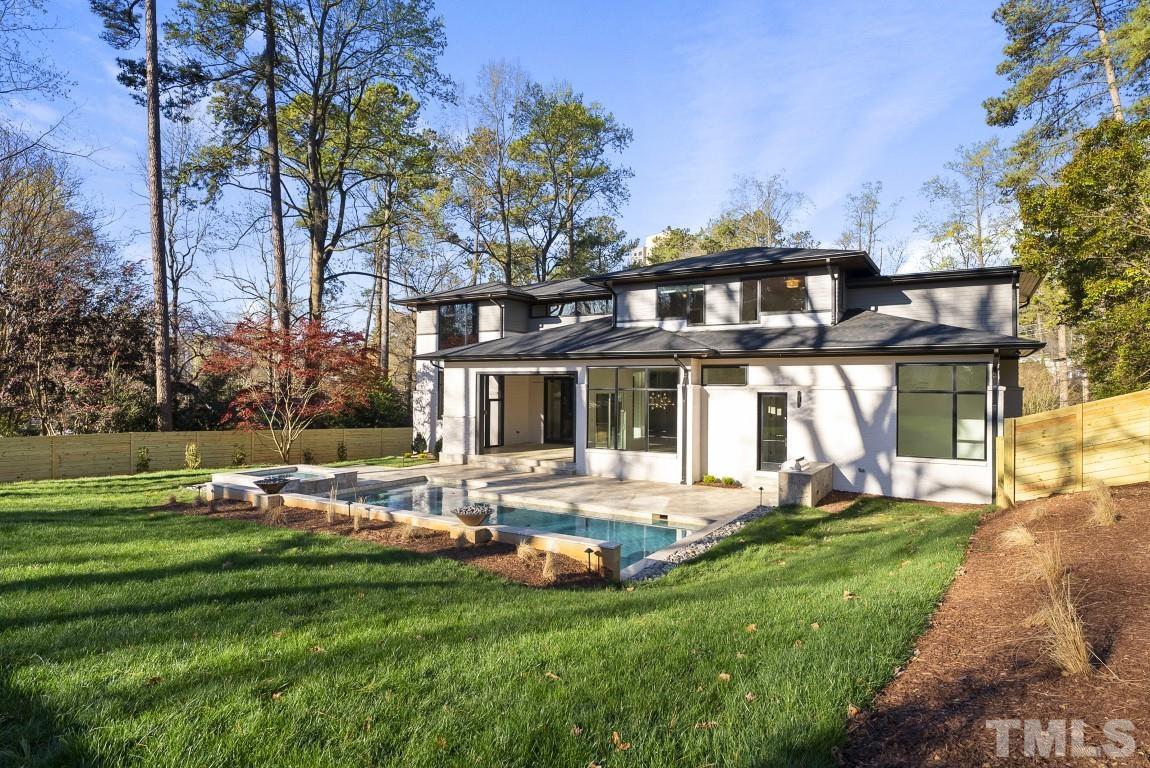 4120 Windsor Place Raleigh, NC 27609 - Photo 3 of 46 a front view of a house with garden and trees