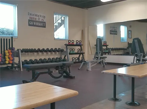 a open kitchen with stainless steel appliances granite countertop a stove refrigerator and cabinets