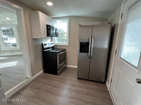 327 Mantoloking Road Brick, NJ 08723 - Photo 11 of 12 a kitchen with stainless steel appliances granite countertop a refrigerator and a sink