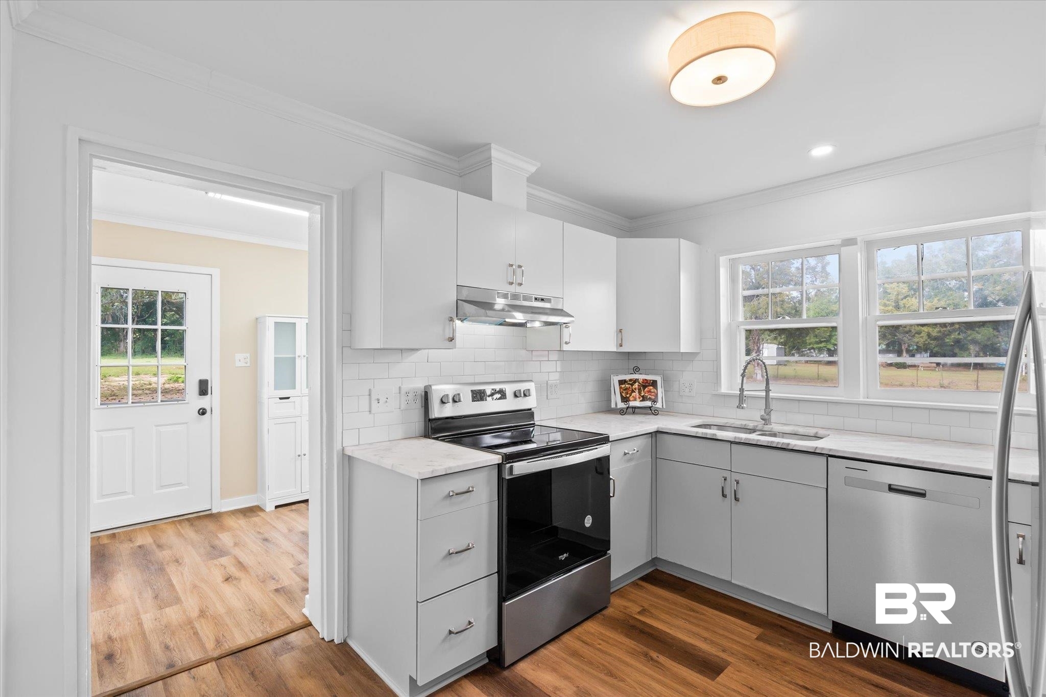 4630 General Road Mobile, AL 36619 - Photo 10 of 33 Kitchen with decorative backsplash, appliances with stainless steel finishes, a wealth of natural light, and sink