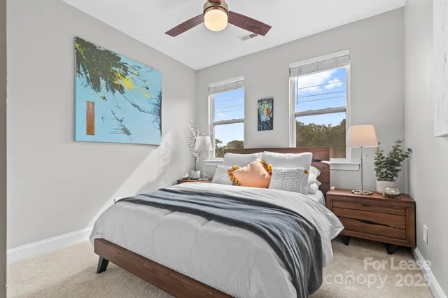 a bedroom with bed and window