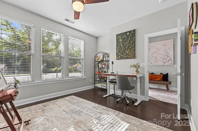 a workspace with furniture and a window