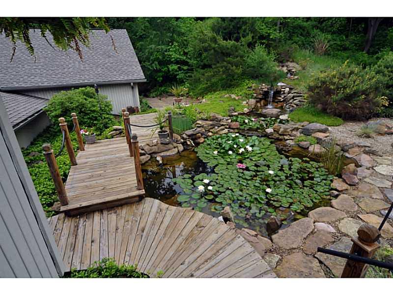 5510 Glass Road Pittsburgh, PA 15205 - Photo 21 of 25 Patio/Deck. The view of the intricate deck patio with pond. A waterfall provides a peaceful environment. The pond includes two natural filters and overflow.