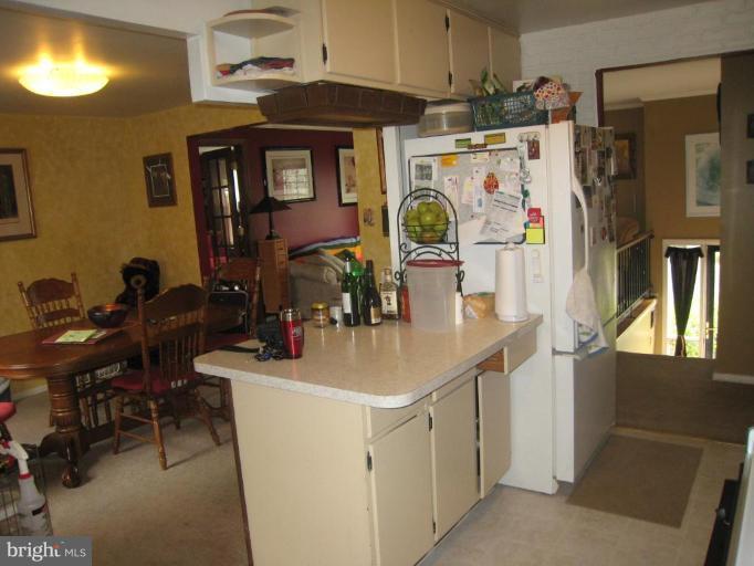 15416 Wembrough Street Silver Spring, MD 20905 - Photo 8 of 13 Part of kitchen and dining room.