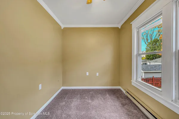 a view of a big room with windows