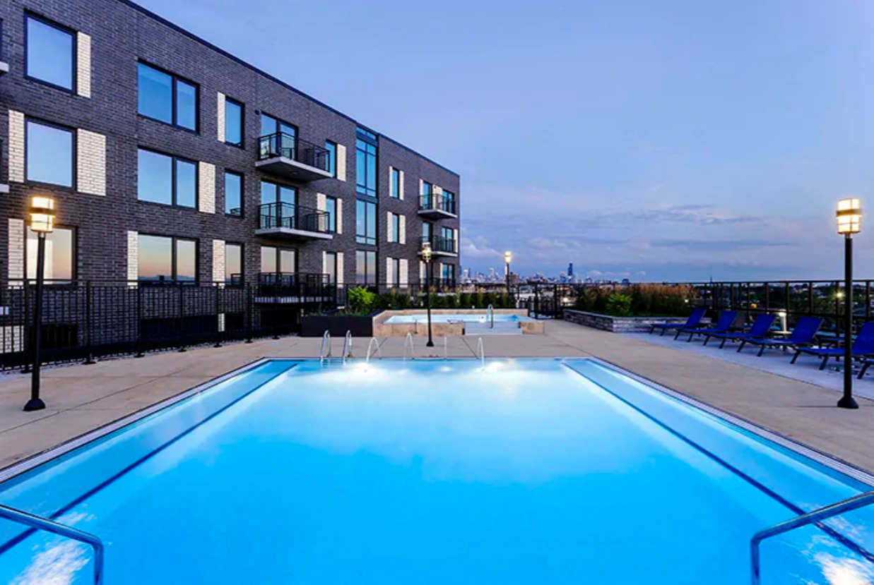 1025 West Addison Street, Unit 701 Chicago, IL 60613 - Photo 12 of 17 a swimming pool with outdoor seating and yard