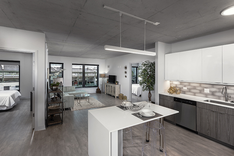 1025 West Addison Street, Unit 701 Chicago, IL 60613 - Photo 3 of 17 a kitchen with a table chairs and wooden floor