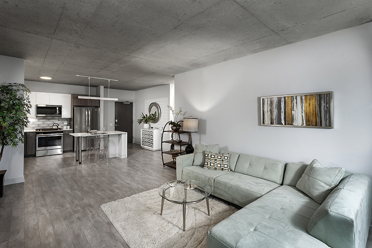1025 West Addison Street, Unit 701 Chicago, IL 60613 - Photo 4 of 17 a living room with furniture and kitchen view