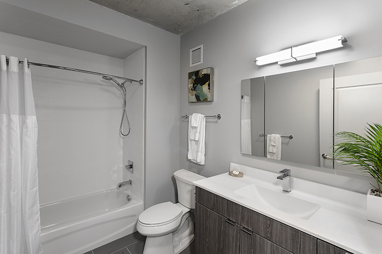 1025 West Addison Street, Unit 701 Chicago, IL 60613 - Photo 7 of 17 a bathroom with a sink toilet and shower