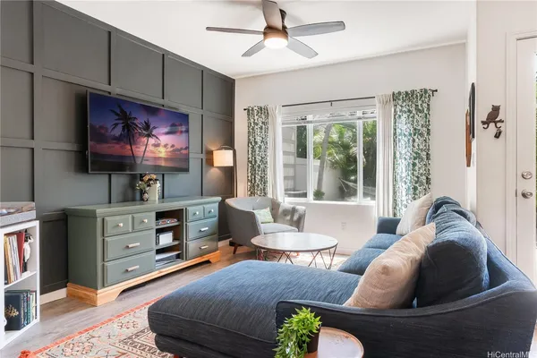 a living room with furniture and a flat screen tv