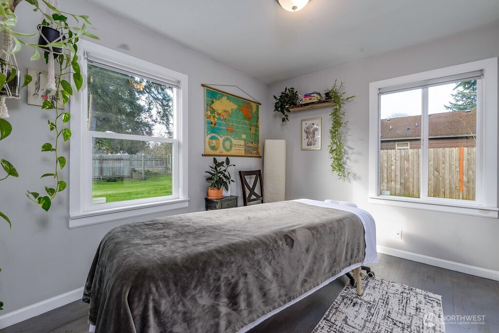 814 117th Street South Tacoma, WA 98444 - Photo 12 of 22 a bed sitting in a bedroom next to a window