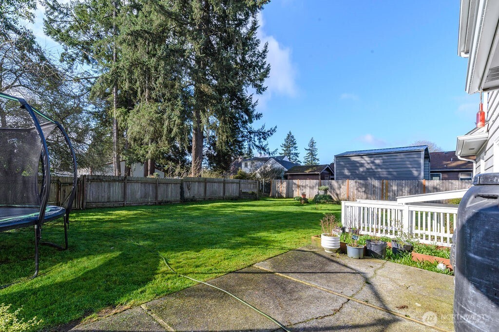 814 117th Street South Tacoma, WA 98444 - Photo 19 of 22 a view of a chair and table in the backyard