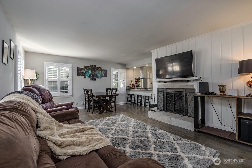 814 117th Street South Tacoma, WA 98444 - Photo 5 of 22 a living room with furniture and a flat screen tv