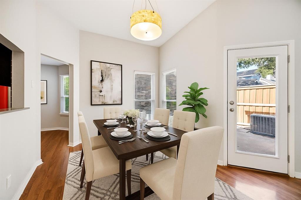 18111 Whispering Gables Lane Dallas, TX 75287 - Photo 6 of 15 a view of a dining room with furniture and wooden floor